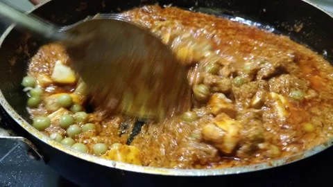 Making Paneer Masala Indian Dish with Peas in a Pan Video stock 344249502