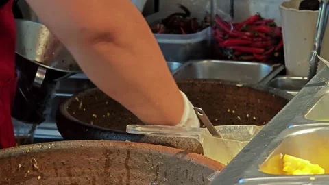 Making Papaya Salad with Fermented Fish. Stock Footage 307592767