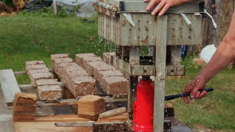Making Paper Bricks from waste cardboards Stock Footage 205948723
