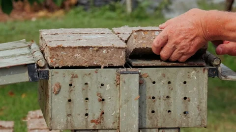 Making Paper Bricks from waste cardboards Stock Footage 207231597