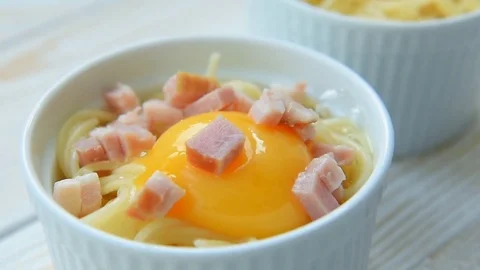 Making pasta with egg and bacon Stock Footage 69748866