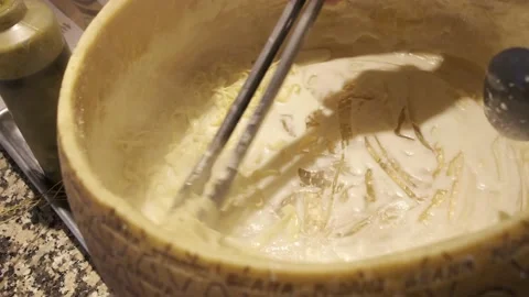 Making pasta on a parmesan wheel 動画素材 236584605