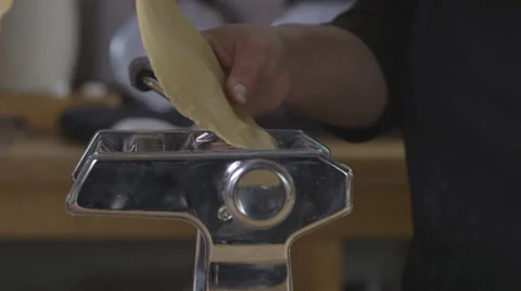Making pasta in a pasta machine Stock Footage 64048411