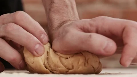 Making pasta using traditional recipe. Man kneading floured dough at home. Stock-Footage 150813405