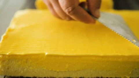 Making pattern on yellow cream cake, slow motion. Stock Footage 92720271