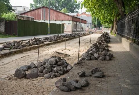 Making the pavement of stone blocks Stock Photos