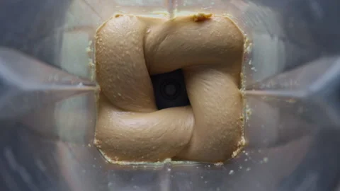 Making peanut butter at home in blender Stock Footage 338289581