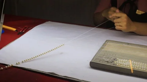 Making pearl neclace Stock Footage 111967595