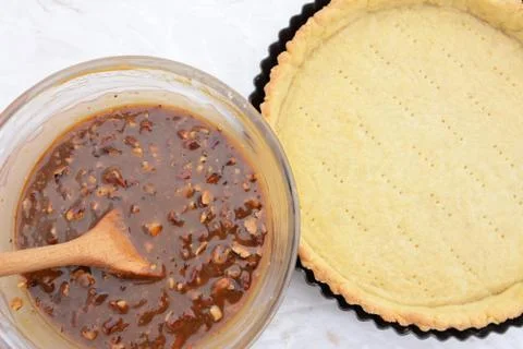 Making pecan pie - nutty pie filling and pie crust Stock Photos