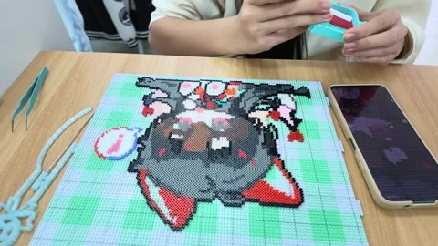 Making perler bead art at a store in Optics Valley, Wuhan Stock-Footage 347178938