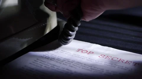 Making a phone call about top secret information in dark room Stock Footage 170847283