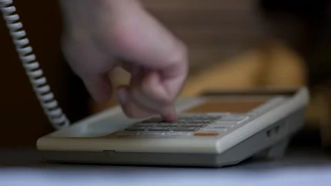 Making a phone call on an old push button telephone Stock Footage 240325370