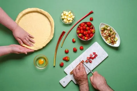 Making a pie top view. Young couple home baking Above view with young peop... Fotos Stock