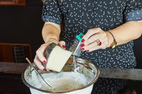 Making a pie in your home kitchen from several types of cheeses, mozzarella Stock Photos