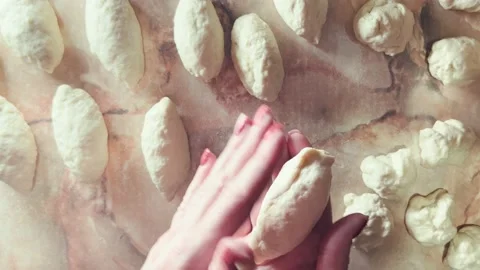 Making pies in home kitchen. Focus on hands of woman. Stock Footage 204815489