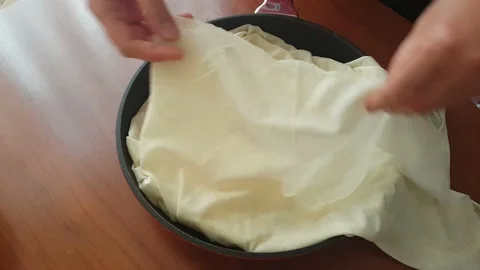 Making pies with phyllo dough in a pan at home 스톡 동영상 166399097