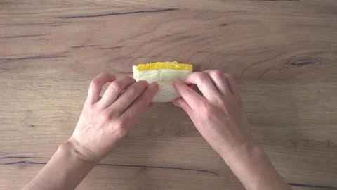 Making Pigs In A Blanket. Wrapping Sausage Into Bread Stock Footage 220350305