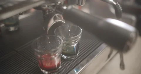 Making pink and blue matcha coffee in coffee machine. 4K Slow Motion Video Stock Footage 114804026