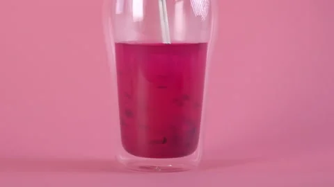 Making pink rose tea with rose petals and dragon fruit powder. Healthy drink. Video stock 171245335