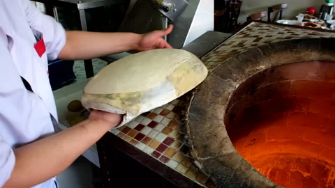 Making Pita Bread, Arabic Bread, Syrian Bread, Indian Flat Bread in Tandoor. Stock Footage 266839789