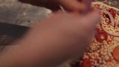 Making a Pizza - Adding Onion Stock Footage 77225668