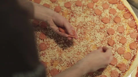 Making a Pizza - Adding the Pepperoni Stock Footage 68978386