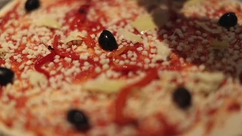 Making a Pizza - Adding Peppers Stock Footage 77225732