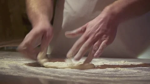 Making pizza or pide dough by close up male hands in pastry kitchen. Vídeos de archivo 84792788
