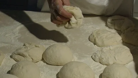 Making pizza or pide dough by close up male hands in pastry kitchen.  Stock Footage 90687658