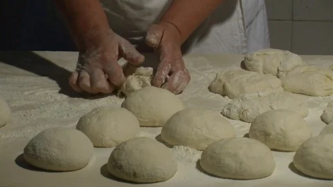 Making pizza or pide dough by close up male hands in pastry kitchen.  Stock Footage 90688006