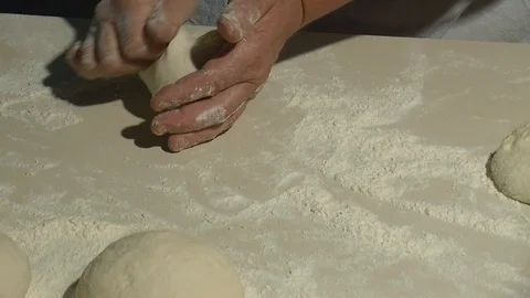 Making pizza or pide dough by close up male hands in pastry kitchen.  Stock Footage 90688550
