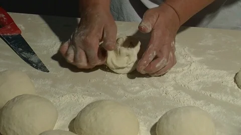 Making pizza or pide dough by close up male hands in pastry kitchen.  Stock Footage 90689114