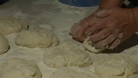 Making pizza or pide dough by close up male hands in pastry kitchen.  Stock Footage 90689169