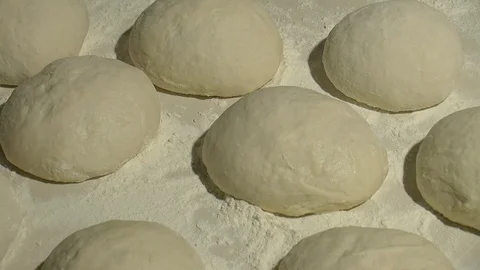 Making pizza or pide dough by close up male hands in pastry kitchen.  Stock Footage
