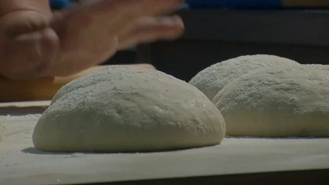 Making pizza or pide dough by close up male hands in pastry kitchen.  Stock Footage 90721168