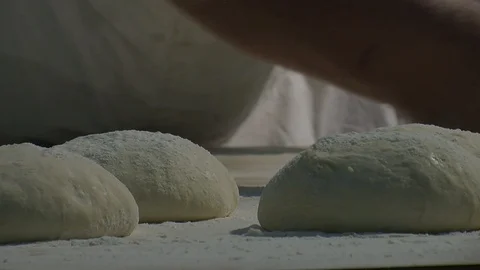 Making pizza or pide dough by close up male hands in pastry kitchen.  Stock Footage 90721301