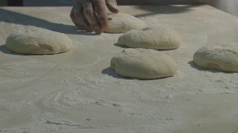 Making pizza or pide dough by close up male hands in pastry kitchen.  Stock Footage 90721631