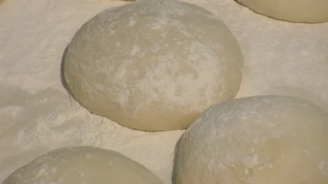 Making pizza or pide dough by close up male hands in pastry kitchen. Shaping dou Stock Footage 90729404