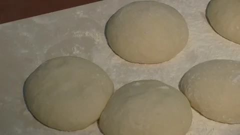Making pizza or pide dough by close up male hands in pastry kitchen. Shaping dou Stock Footage 90729636