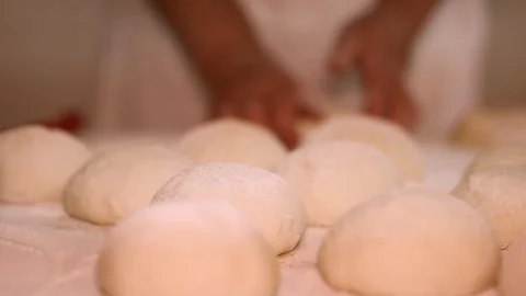 Making pizza or pide dough by close up male hands in pastry kitchen. Shaping dou Stock Footage 90730956