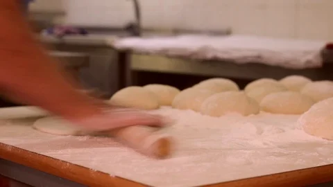 Making pizza or pide dough by close up male hands in pastry kitchen. Shaping dou Stock Footage 90732815