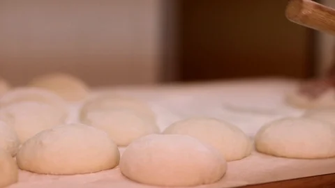 Making pizza or pide dough by close up male hands in pastry kitchen. Shaping dou Stock Footage 90733158