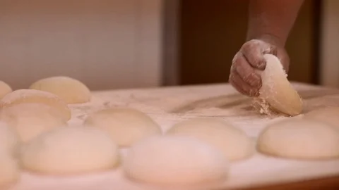 Making pizza or pide dough by close up male hands in pastry kitchen. Shaping dou Stock Footage 90733296