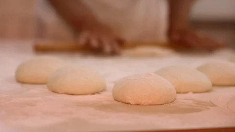 Making pizza or pide dough by close up male hands in pastry kitchen. Shaping dou Stock Footage 90735224