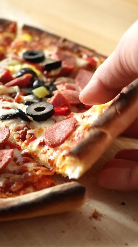 Making a pizza with pepperoni and olives at home Stock Footage 335431460