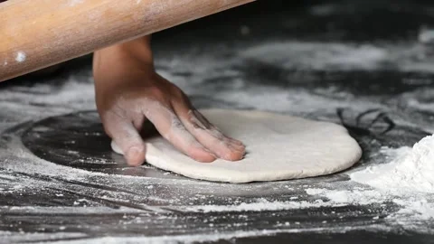 Making pizza the process ,Making dough by male hands,pizza prepare dough by Stock Footage 149577536