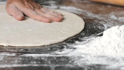 Making pizza the process ,Making dough by male hands,pizza prepare dough Stock Footage 149577774