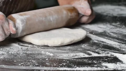 Making pizza the process ,Making dough by male hands,pizza prepare dough Stock Footage 149577858