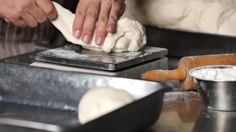 Making pizza the process ,Making dough by male hands,pizza prepare dough Stock Footage 149577941