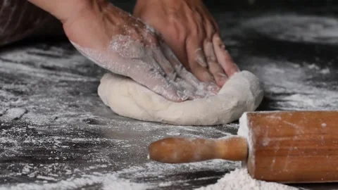 Making pizza the process ,Making dough by male hands,pizza prepare dough Stock Footage 149577946
